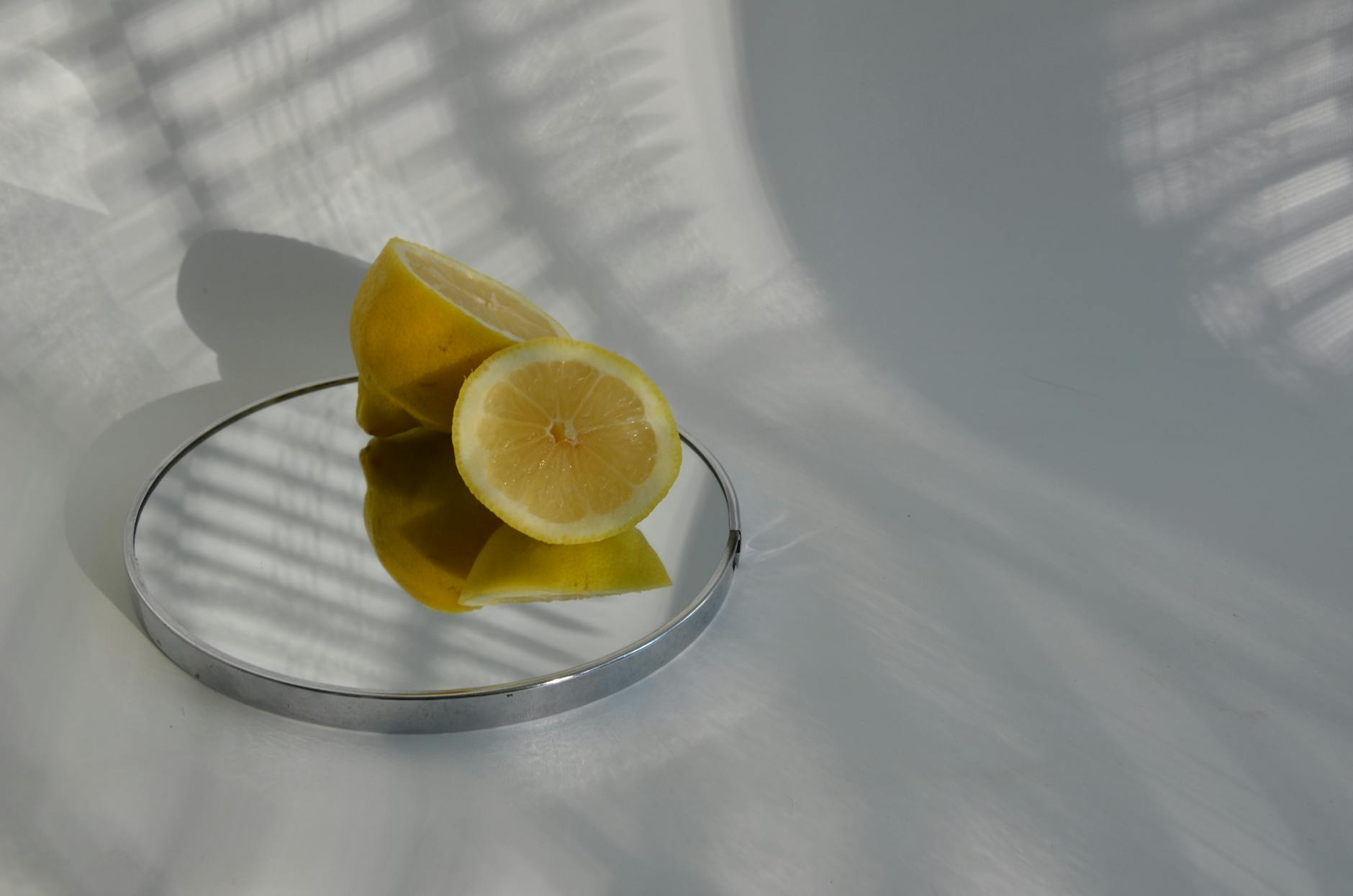 Bright yellow lemons arranged on a pastel green background, symbolizing the refreshing and energizing nature of improved arousal with partners.